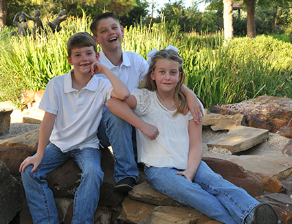 Lantzy Children sitting on lawn