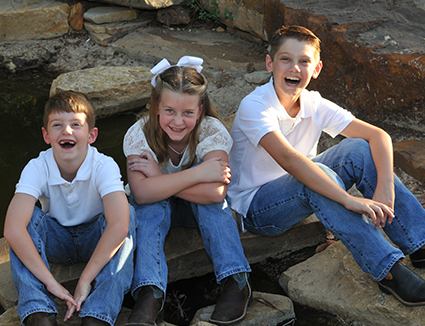 Lantzy Children sitting on lawn